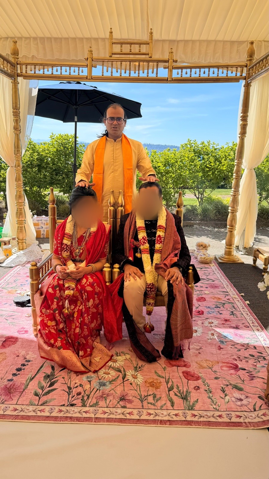 Namkaran Sanskar Family Blessing — Whispering the child's auspicious Vedic name in the right ear with prayers for longevity and wisdom.